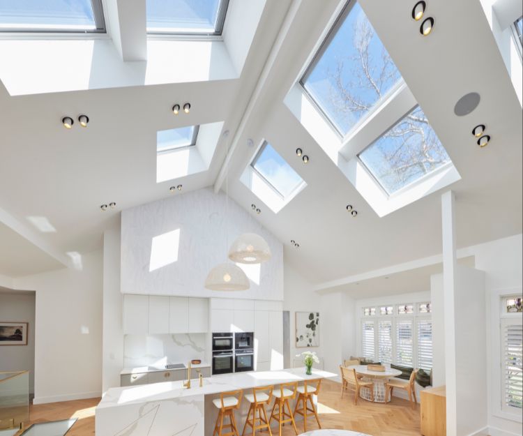 skylight windows over white home